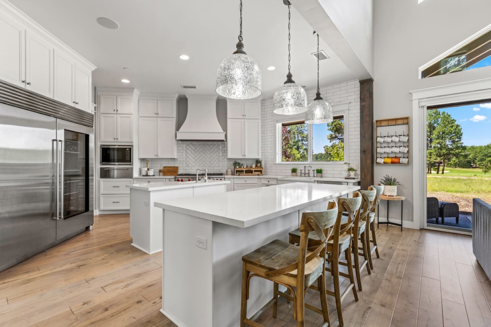 Casa Alta — chef's kitchen with double islands, Wolf range and Sub-Zero
