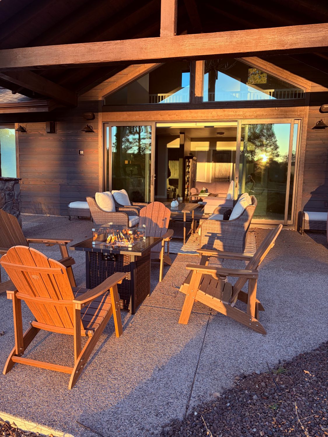 Casa Alta — covered timber-frame patio lounge at sunset
