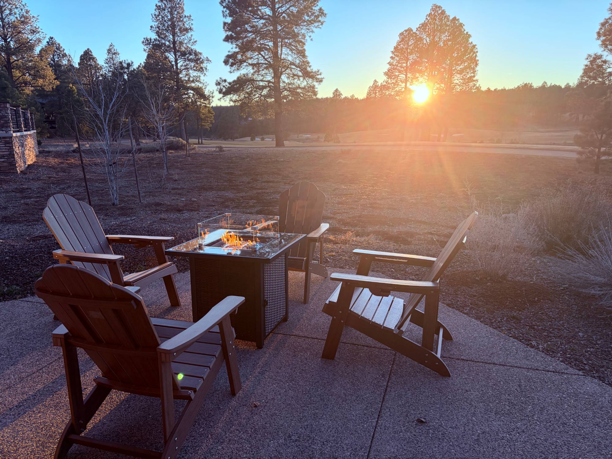 Casa Alta — gas fire-pit table on the covered patio at sunset, looking over the golf fairway in Flagstaff Ranch