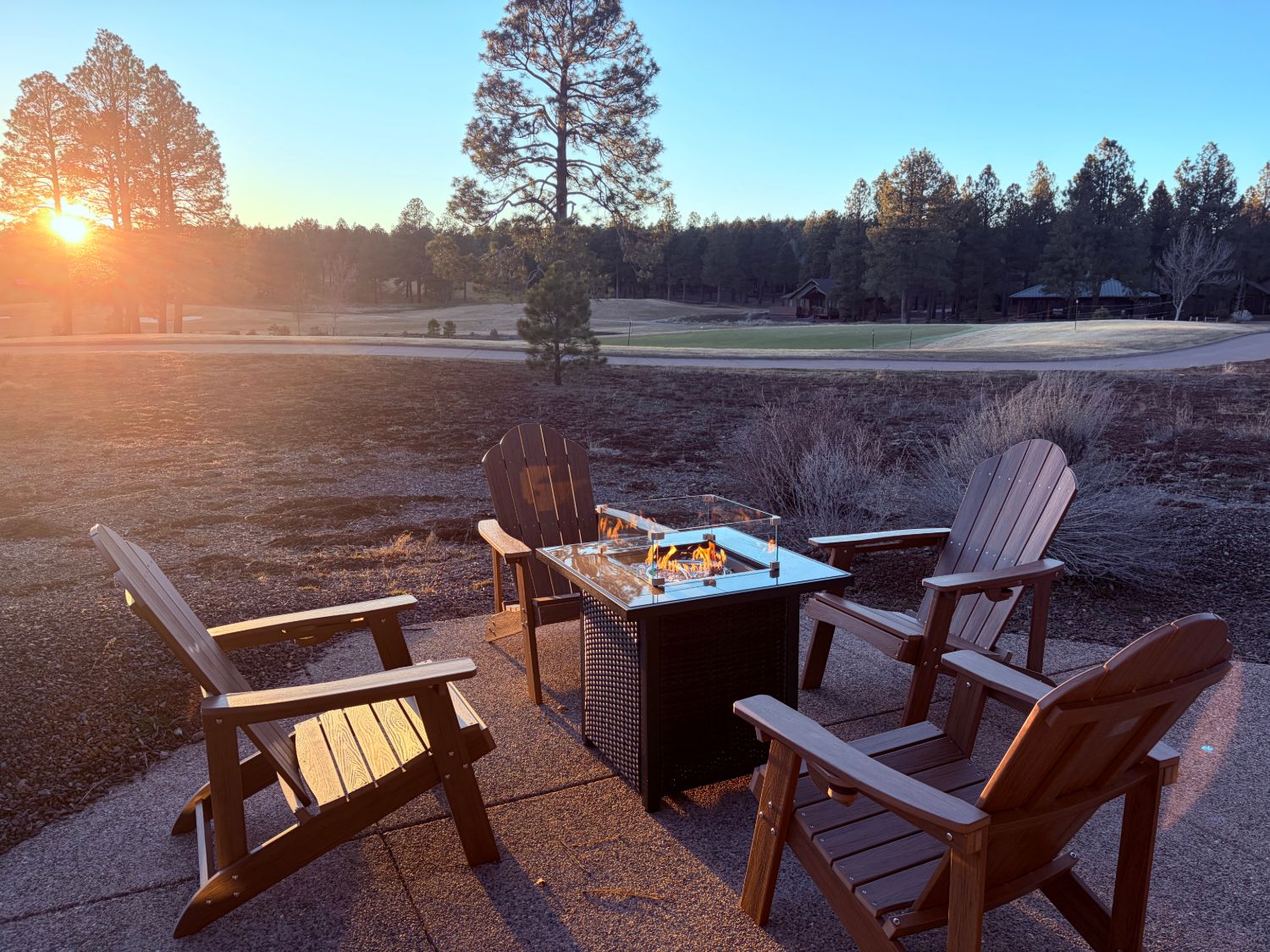 Casa Alta — patio fire pit at sunset over the green